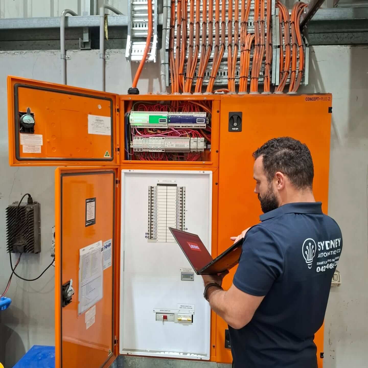 George Skarmoutsos on-site — Sydney Automation Co. uniform, commercial automation commissioning